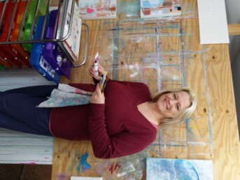 Artist Sunday L at her easel
